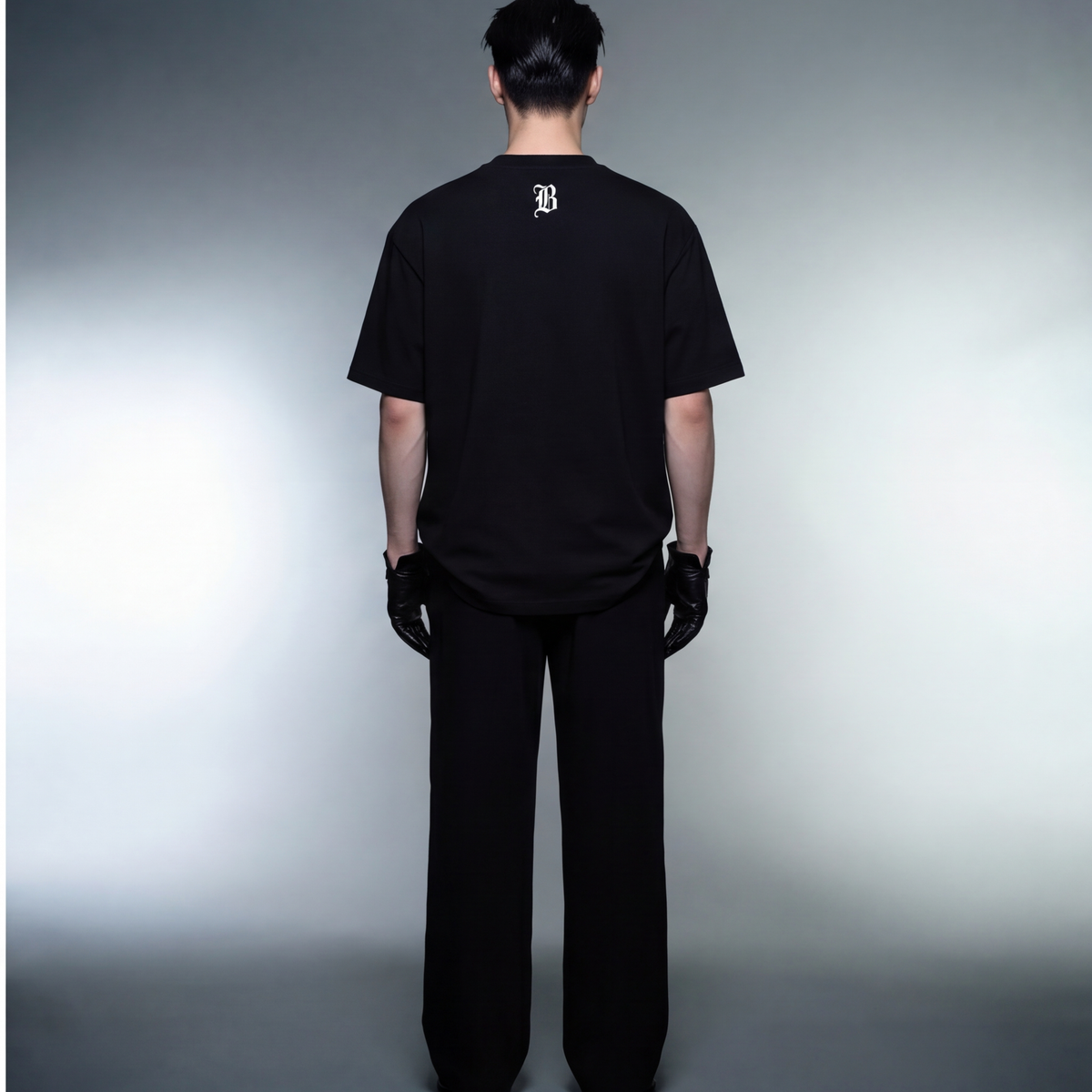 curly-hair-guy-blacklist-blck-t-shirt model back